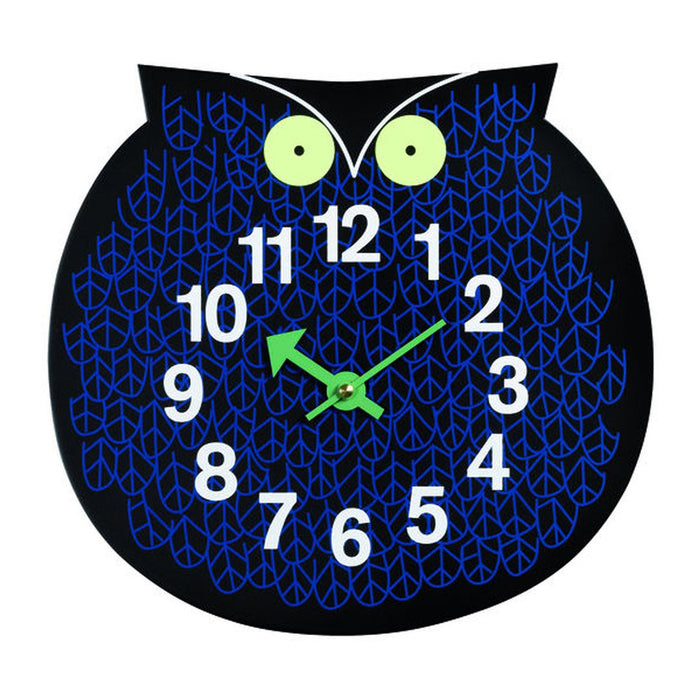 Owl-shaped wall clock featuring a black background, blue geometric pattern, and green clock hands.