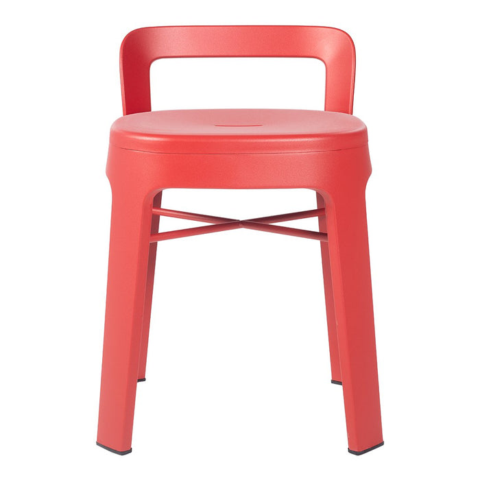 Red metal chair with a sleek design and smooth finish, featuring a minimalist backrest and cross-braced legs.