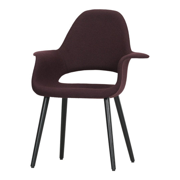 Burgundy upholstered chair with a sleek design and black legs, featuring a smooth, modern silhouette.