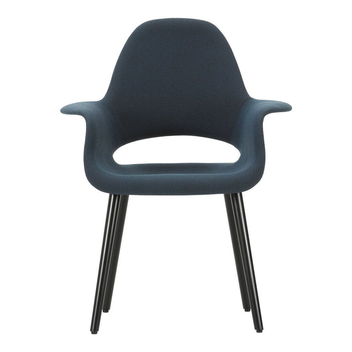 Modern dark blue chair with smooth curves and black tapered legs, perfect for contemporary decor.