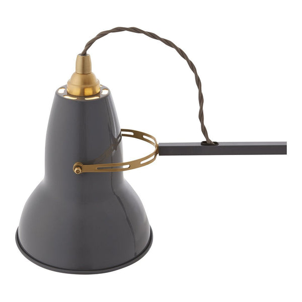 Industrial-style gray pendant lamp with a gold accent and braided brown cord. Perfect for modern decor.