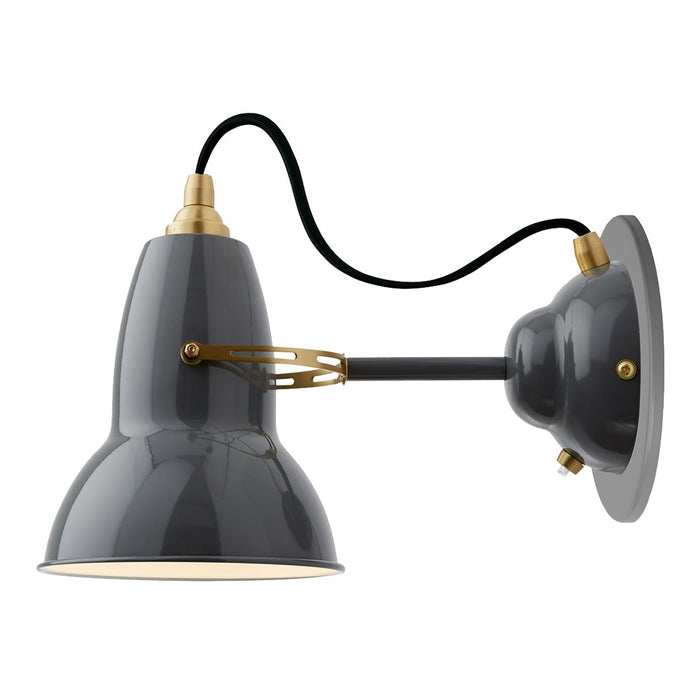 Gray metal wall lamp with a glossy finish and brass accents, featuring an industrial design.