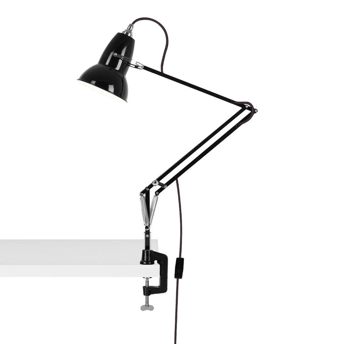 Black industrial desk lamp with adjustable arm and clamp, featuring a minimalist design against a white background.