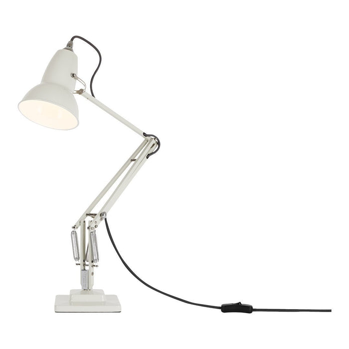 White adjustable desk lamp with a modern design and minimalist style. Features a smooth finish and black cord accents.