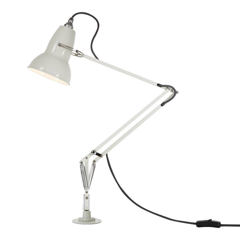 White and gray desk lamp with sleek, modern design and adjustable arm and shade.