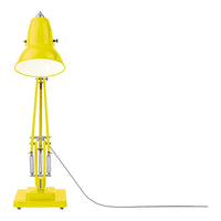 Bright yellow lamp with a sleek design and modern finish, featuring a glossy shade and matching base.