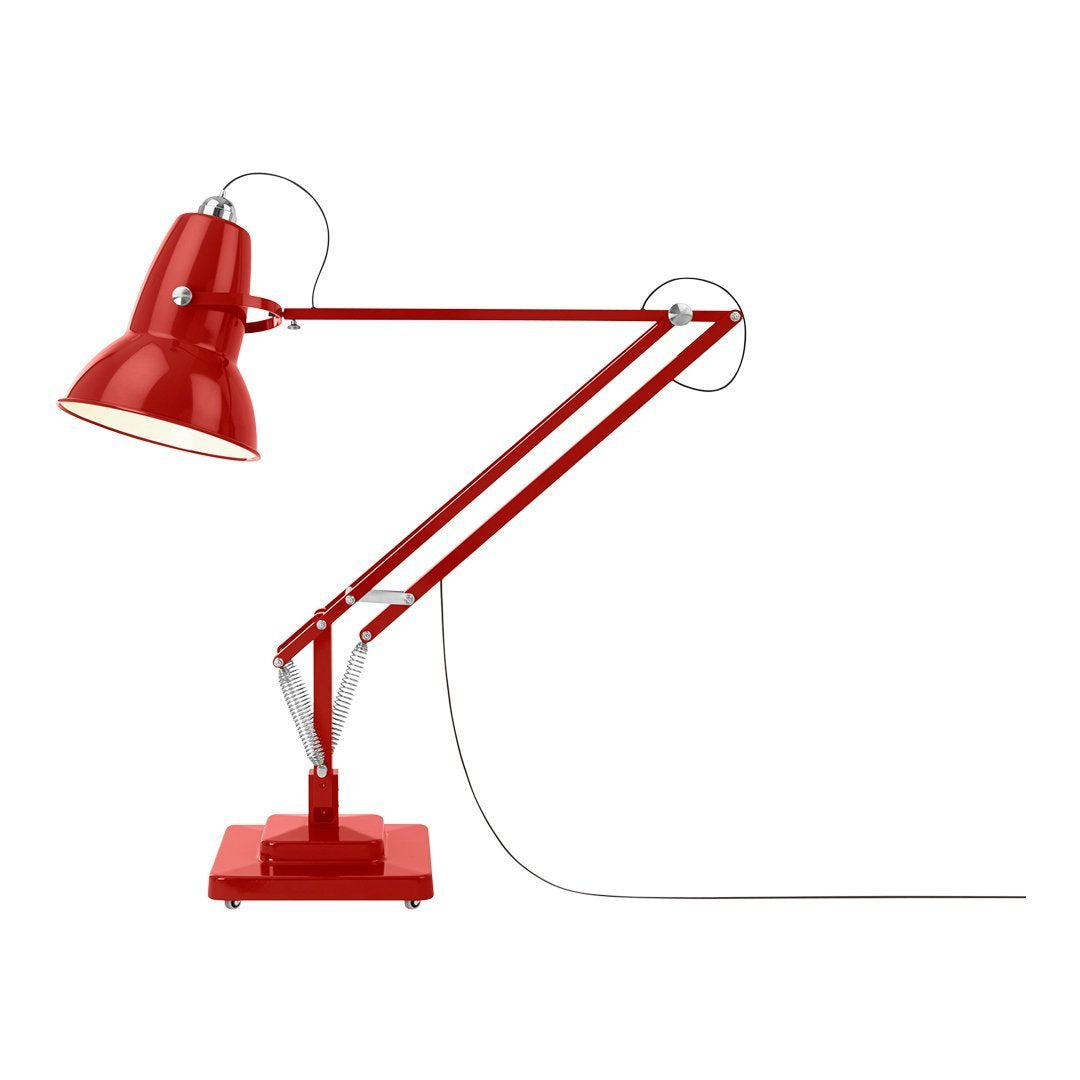 Red industrial desk lamp with a glossy finish, featuring adjustable arms and a coordinated base.