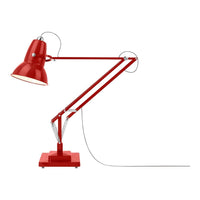 Red industrial desk lamp with a glossy finish, featuring adjustable arms and a coordinated base.