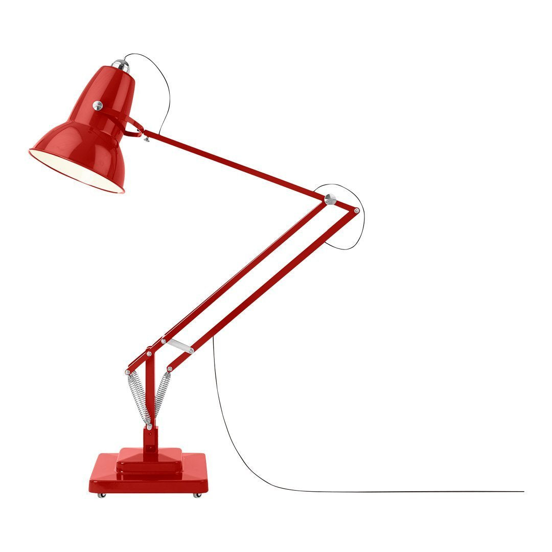 Red adjustable desk lamp with a glossy finish and sleek metallic accents. Stylish and modern design for any workspace.