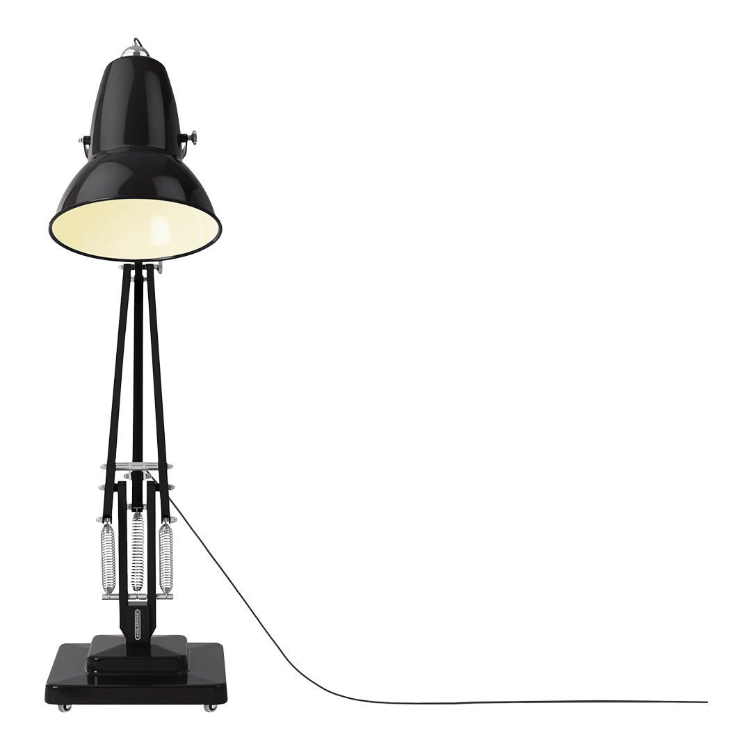 Black industrial-style lamp with a white interior shade and sleek metal accents. Elegant and modern design.