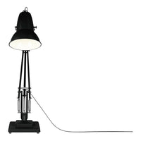 Black industrial-style floor lamp with a sleek shade and minimalistic design. Ideal for modern interiors.