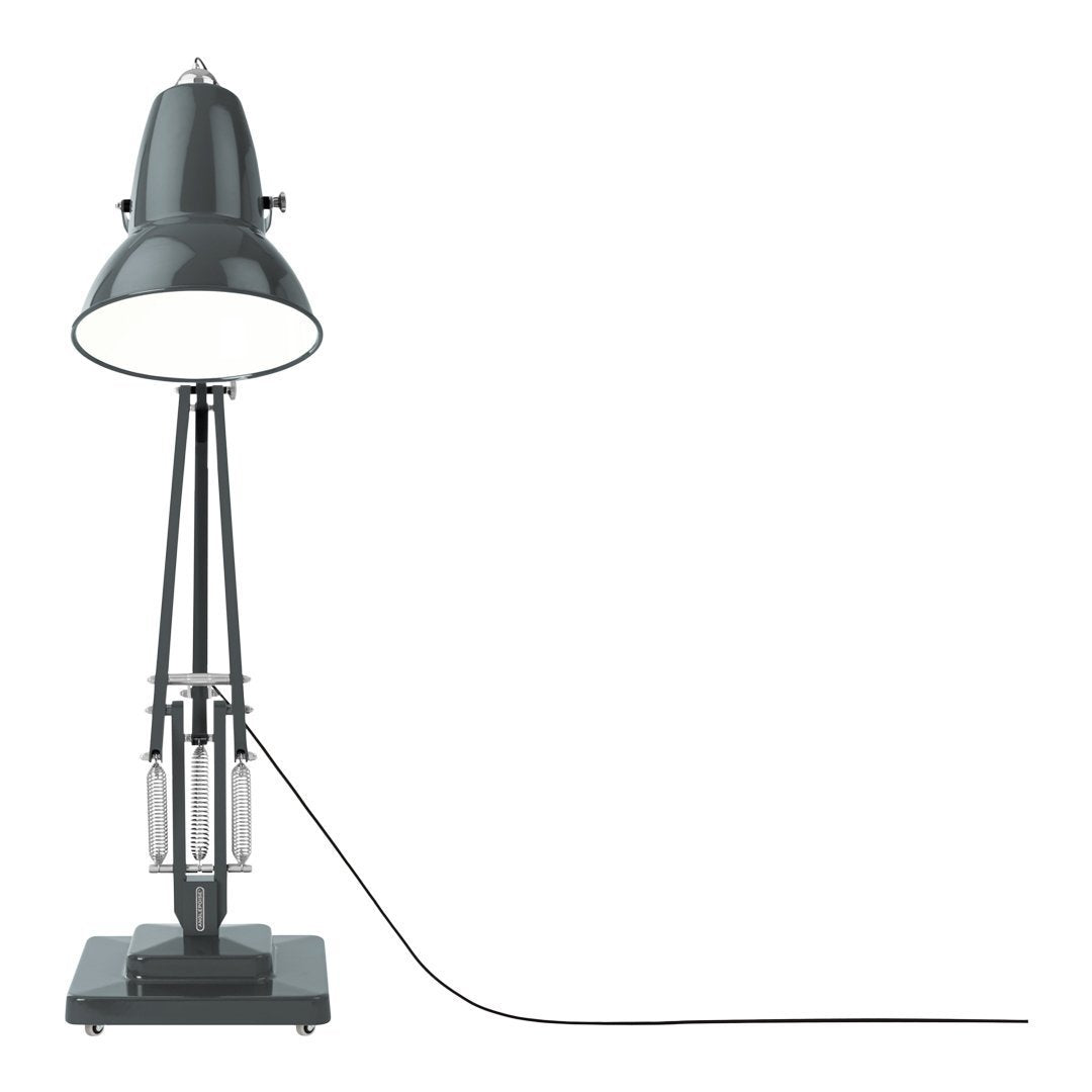 Industrial-style gray desk lamp with a shiny metal shade and black cord on a square base.
