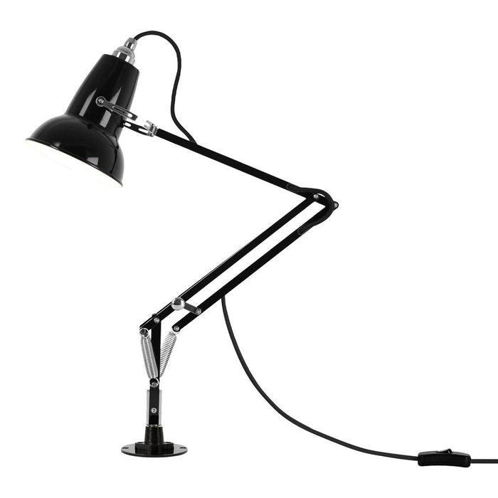 Black metal desk lamp with sleek adjustable arm and chrome accents, showcasing a minimalist design.