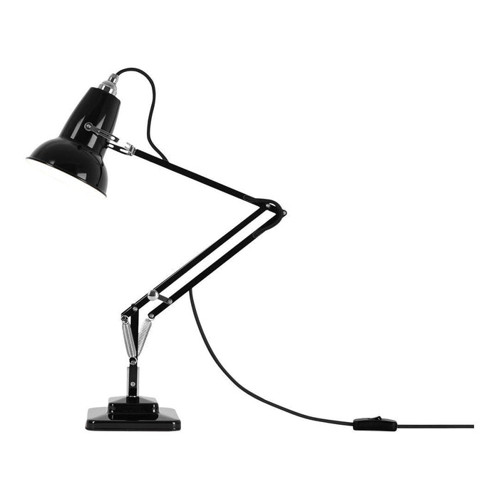 "Black adjustable desk lamp with chrome accents and sleek metallic finish, featuring a minimalist design."