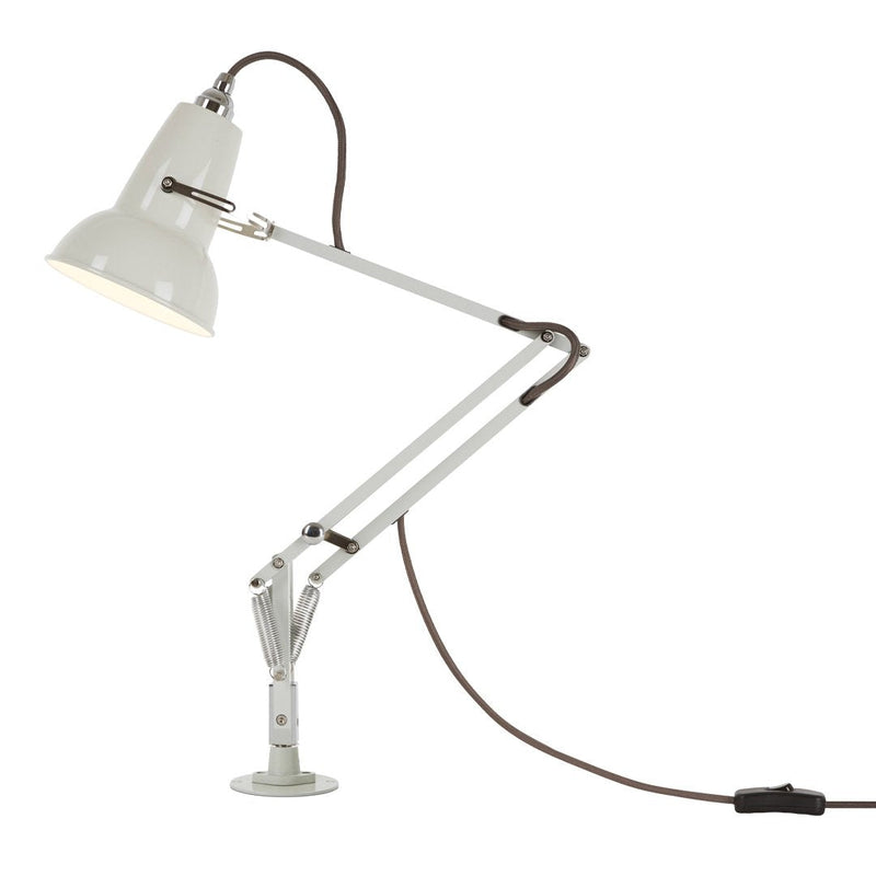White adjustable desk lamp with metal finish and brown cord, featuring sleek, modern lines and minimalistic design.