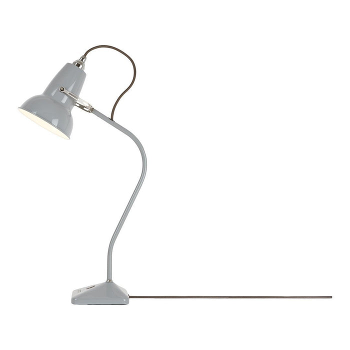 Gray desk lamp with a smooth finish and a curved base, paired with a brown cord for a modern touch.