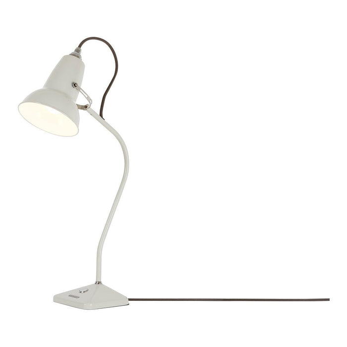 White metal desk lamp with a sleek, minimalist design and contrasting bronze-colored elbow and cord.