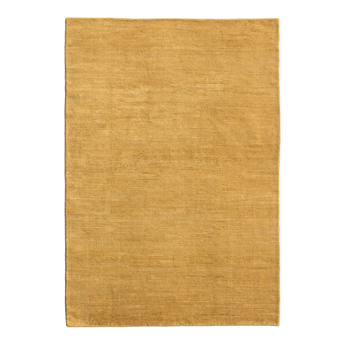 Plain golden yellow area rug with a soft, textured surface, perfect for adding warmth to any space.
