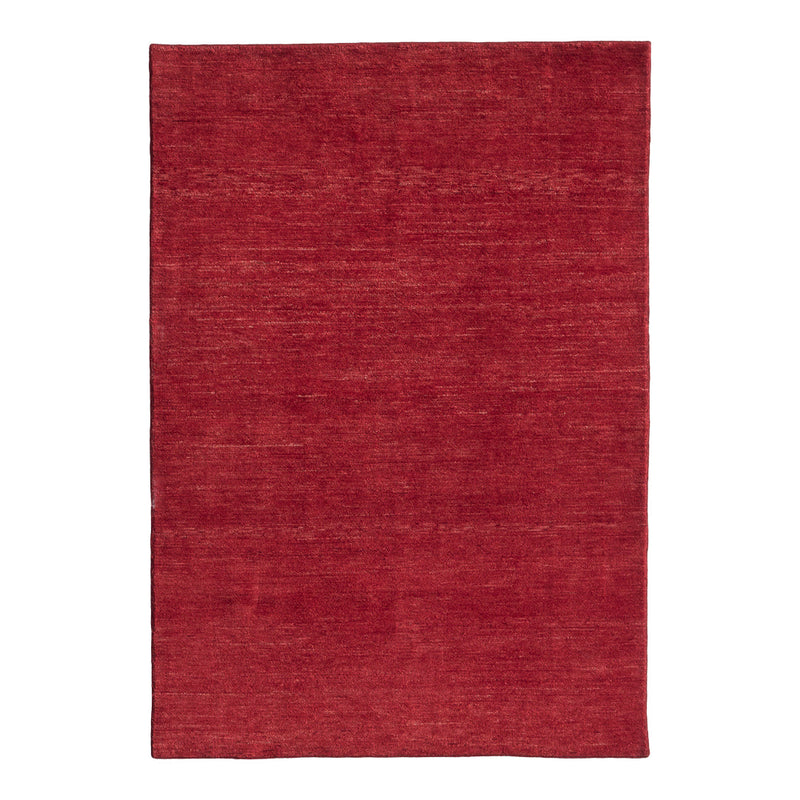 Solid red area rug with a subtle texture, adding warmth and depth to any room decor.