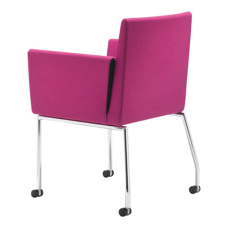 Bright pink upholstered chair with sleek chrome legs and modern design. Perfect for contemporary spaces.