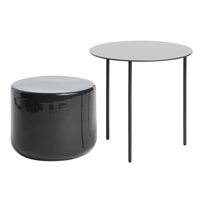Black round side table and glossy black pouf, featuring sleek modern design and smooth finishes.