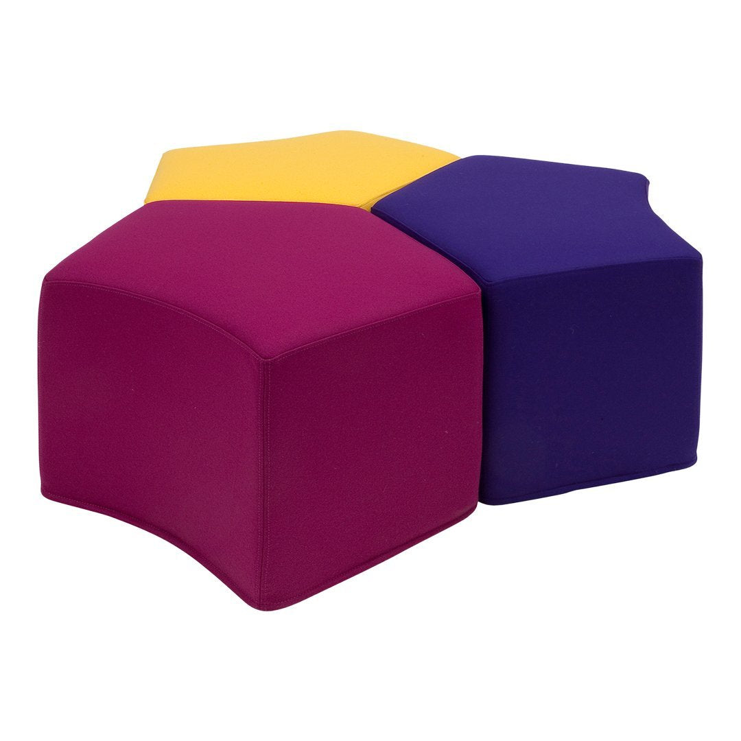 Colorful hexagonal seating in purple, yellow, and magenta with a smooth, soft surface. Ideal for playful decor.