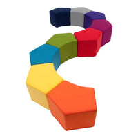 Colorful hexagonal foam seating in a playful rainbow pattern, featuring yellow, green, blue, and purple shades.