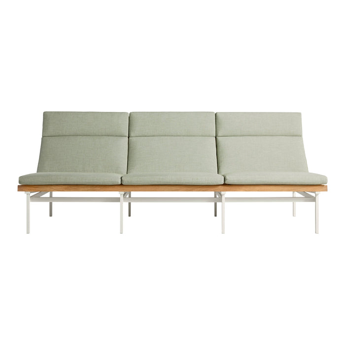 Light green upholstered sofa with sleek white frame and wooden base, featuring a minimalist, modern design.