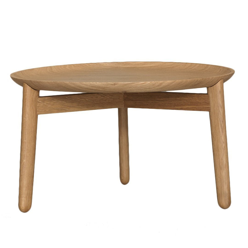"Round wooden coffee table in natural oak finish with simple, smooth surfaces and light wood tones."