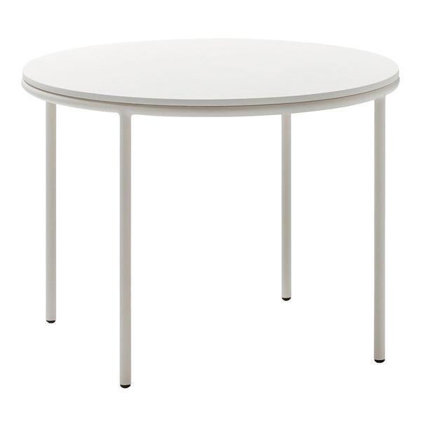 Round white table with a smooth surface and sleek metal legs, perfect for modern dining spaces.