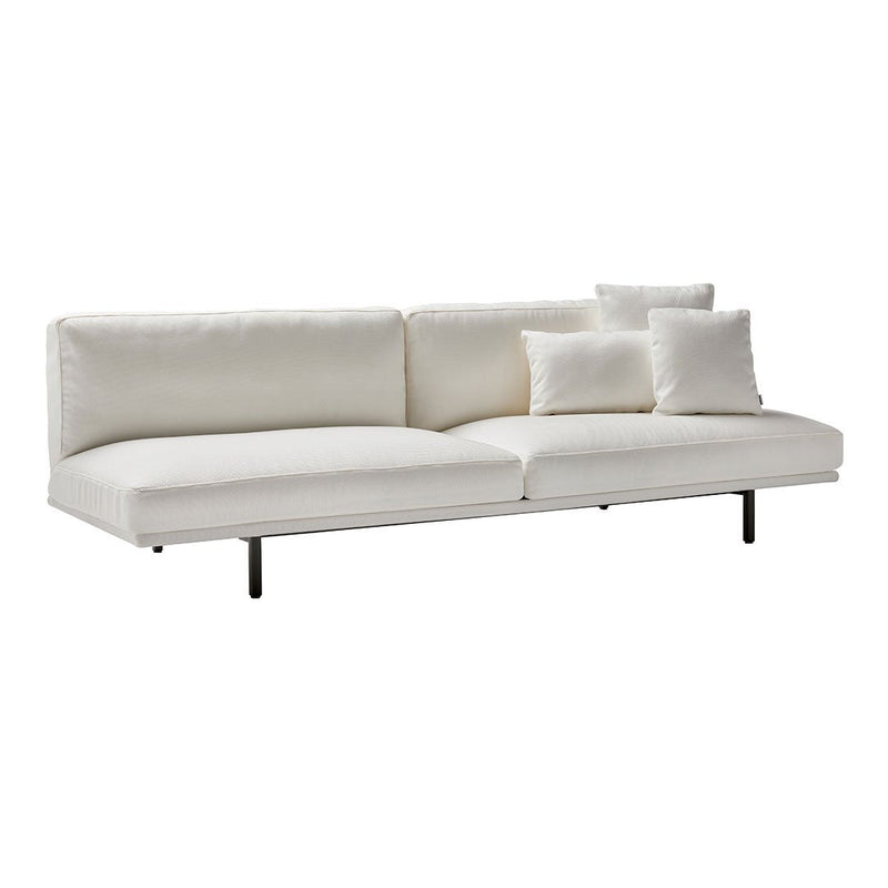 Modern white sectional sofa with clean lines and plush cushions. Minimalist design for contemporary interiors.