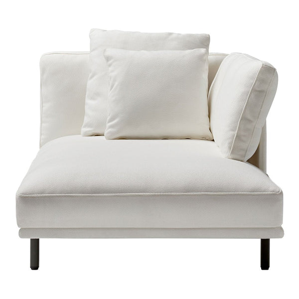 Modern white chaise lounge with plush cushions, showcasing a minimalist design and clean lines. Perfect for any decor.