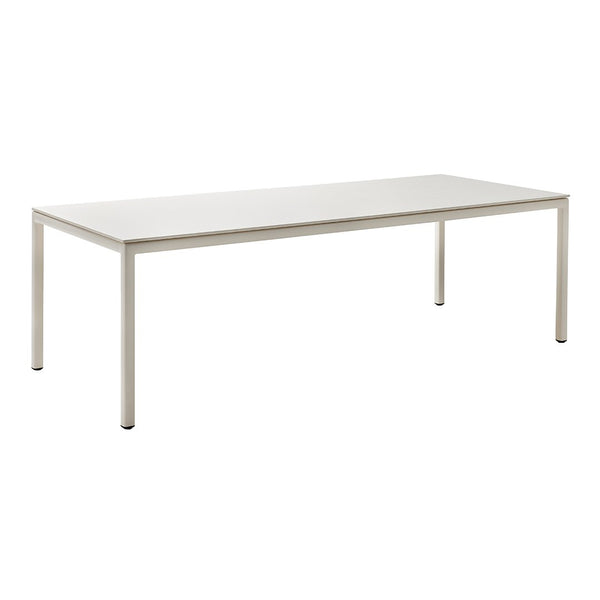 Sleek white rectangular dining table with a minimalist design and smooth surface, perfect for modern decor.