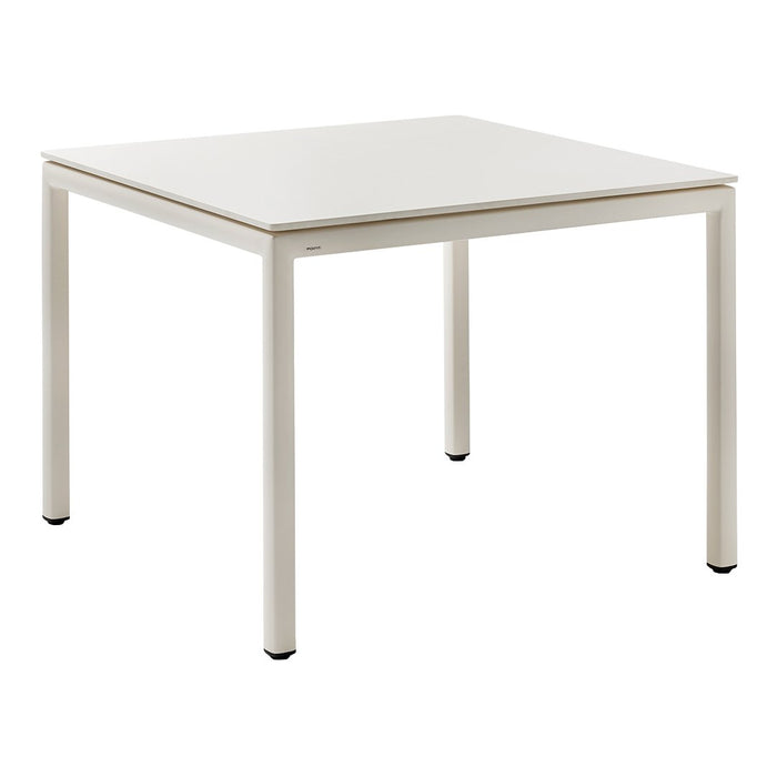 Square table with a sleek white top and light beige metal legs, perfect for modern interiors.