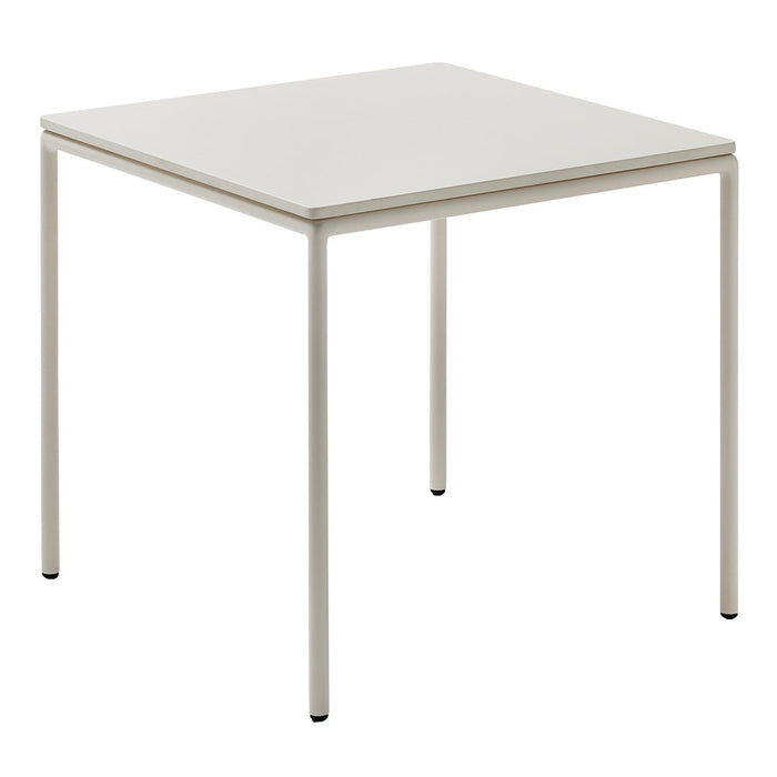 Square white table with a smooth top and sleek metal legs in a matte finish, perfect for modern decor.