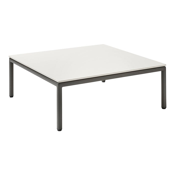 Square coffee table with a sleek white top and minimalist dark metal legs, featuring a clean, modern design.