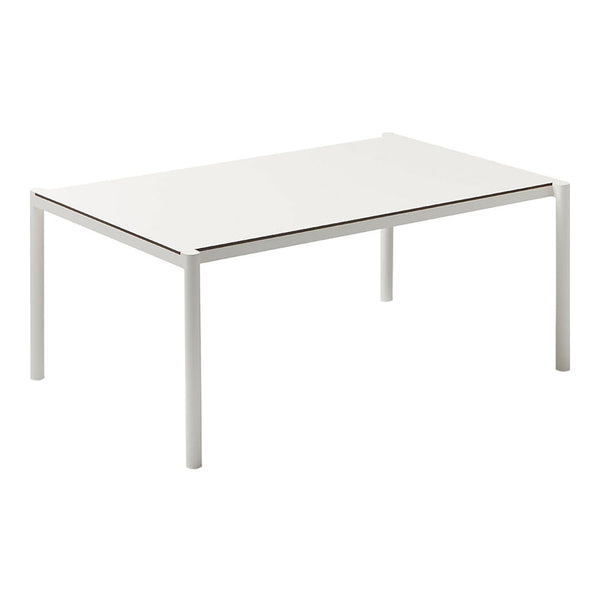 White rectangular table with a smooth, glossy surface and minimalist design. Modern aesthetic with sleek metal legs.