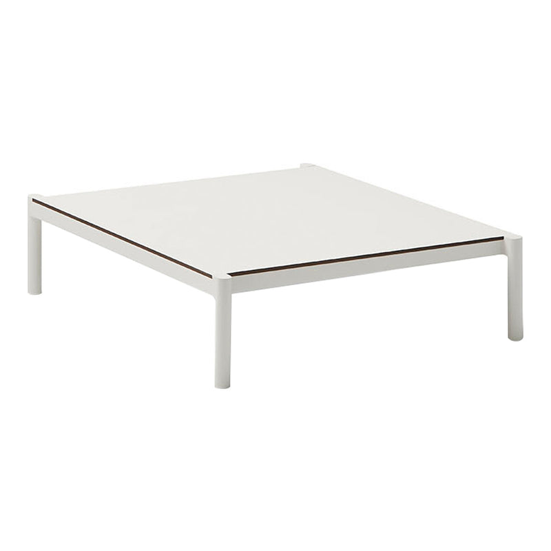 Minimalist white square coffee table with a sleek design and subtle brown accent on the surface.