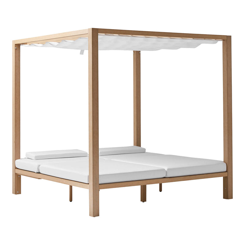 Wooden canopy bed with a natural finish and crisp white cushions, featuring a minimalist design.