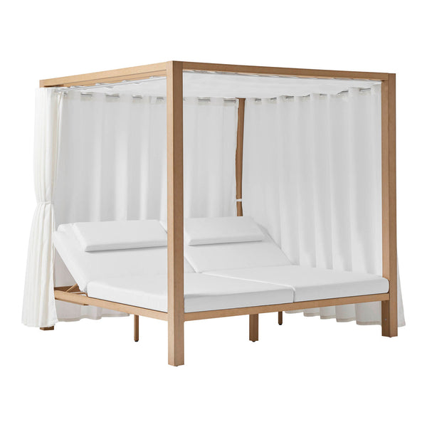 White canopy bed with soft cushions and sheer curtains, featuring a natural wood frame and minimalist design.