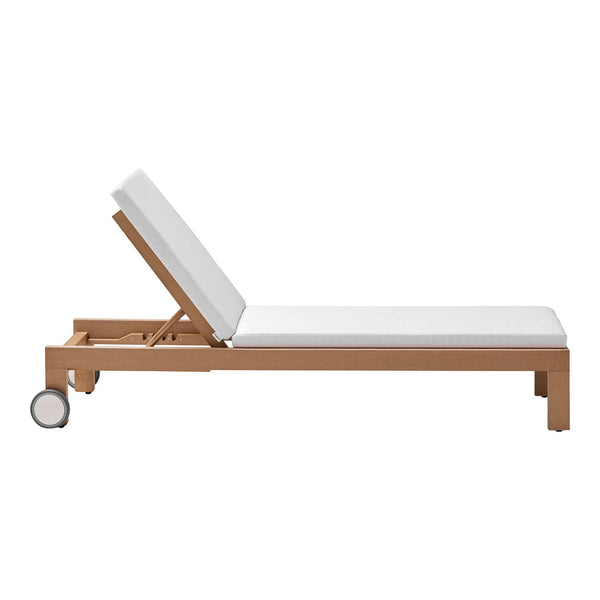 White cushioned lounge chair with a natural wood frame, featuring a simple, modern design.