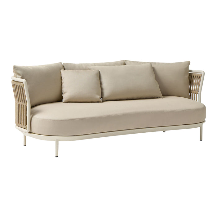 Beige outdoor sofa with soft cushions and elegant woven sides, perfect for a modern patio setup.