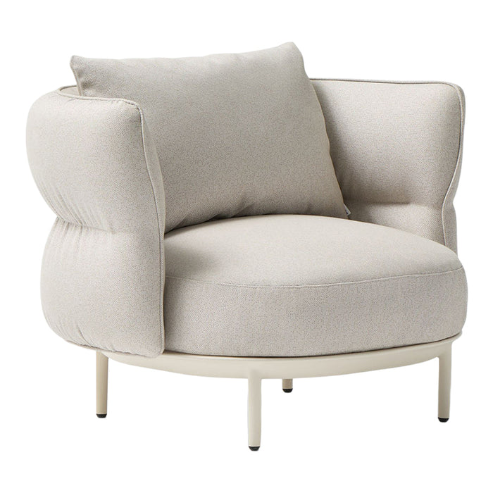 Cream-colored upholstered armchair with soft, rounded lines and a minimalist design. Includes a matching cushion.