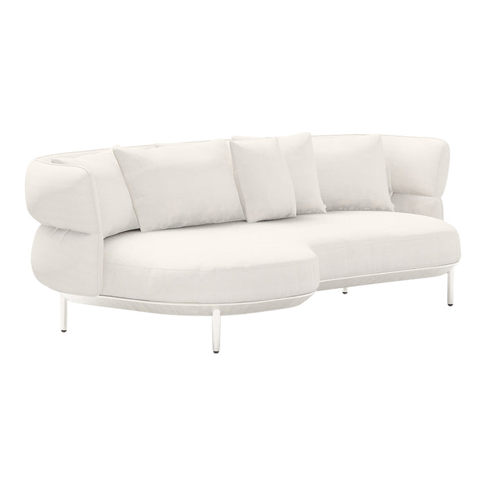 Soft white curved sofa with plump cushions, featuring a smooth, minimalist design and sleek metal legs.
