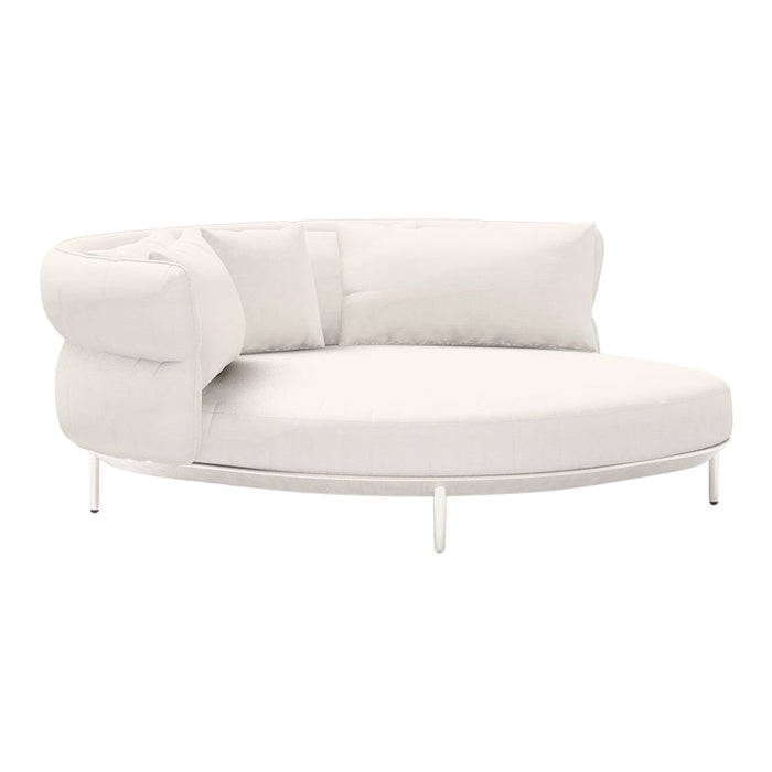 White curved sofa with smooth lines and a modern design, featuring plush cushions and a minimalist aesthetic.