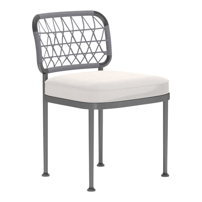 Gray metal chair with a geometric patterned backrest and a soft white seat cushion.