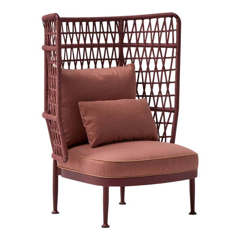 Rust-colored armchair with geometric wicker pattern and plush cushions, adding warmth to any space.