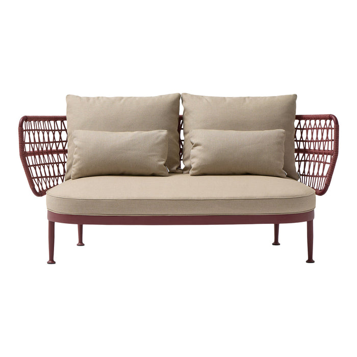Red metal frame sofa with beige cushions and woven side panels, perfect for modern outdoor decor.