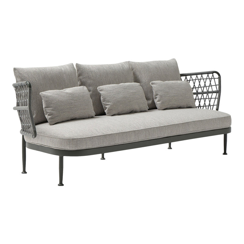 Gray outdoor sofa with textured cushions and intricate black metal backrest. Stylish and modern design for outdoor seating.