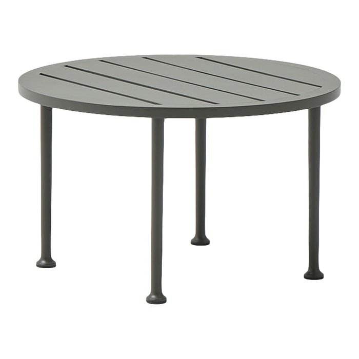 Round gray metal table with slatted top and four slender legs, perfect for outdoor dining or relaxation.